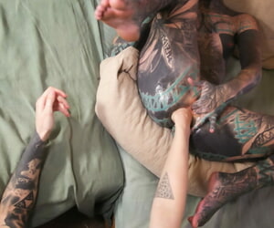 Deeply tattooed girl has..